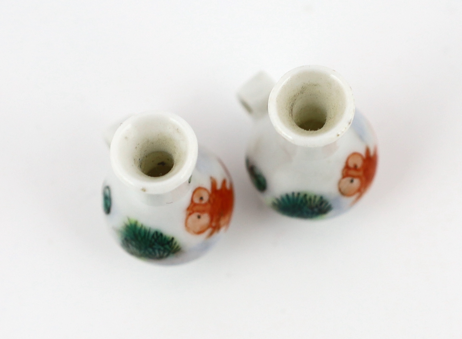 A pair of Chinese enamelled porcelain ‘goldfish’ bird feeders, Guangxu period